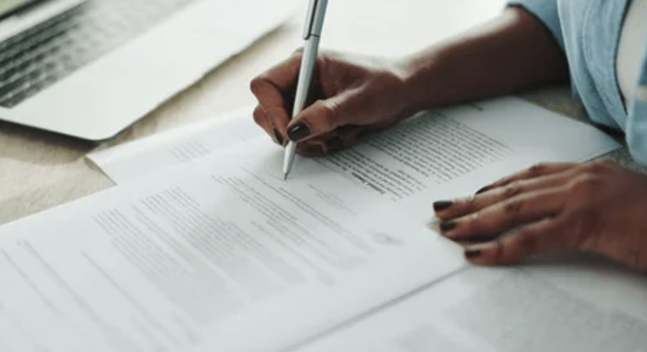 financial reports for small business year-end man writing
